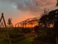 de buik van rotterdam - de koeienstal - zonsondergang - land.png